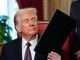 President Donald Trump signs executive orders